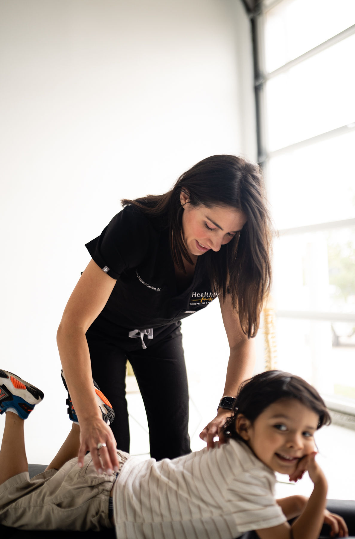 Dr. Alayna Pagnani Holding a Baby - Chiropractic Doctor in Houston Texas